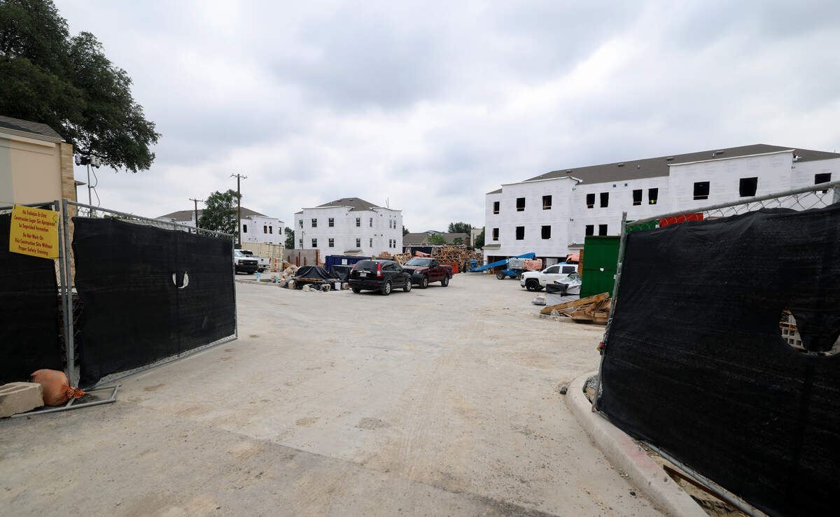 A construction crew works on a new townhome complex on Sandage Avenue near TCU campus on Tuesday, June 16, 2026.